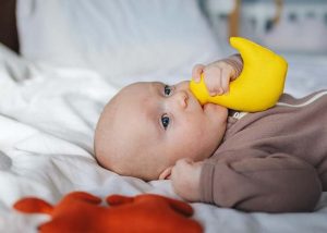 Babies bringing objects to their mouth can be a potential sign they may be hungry.